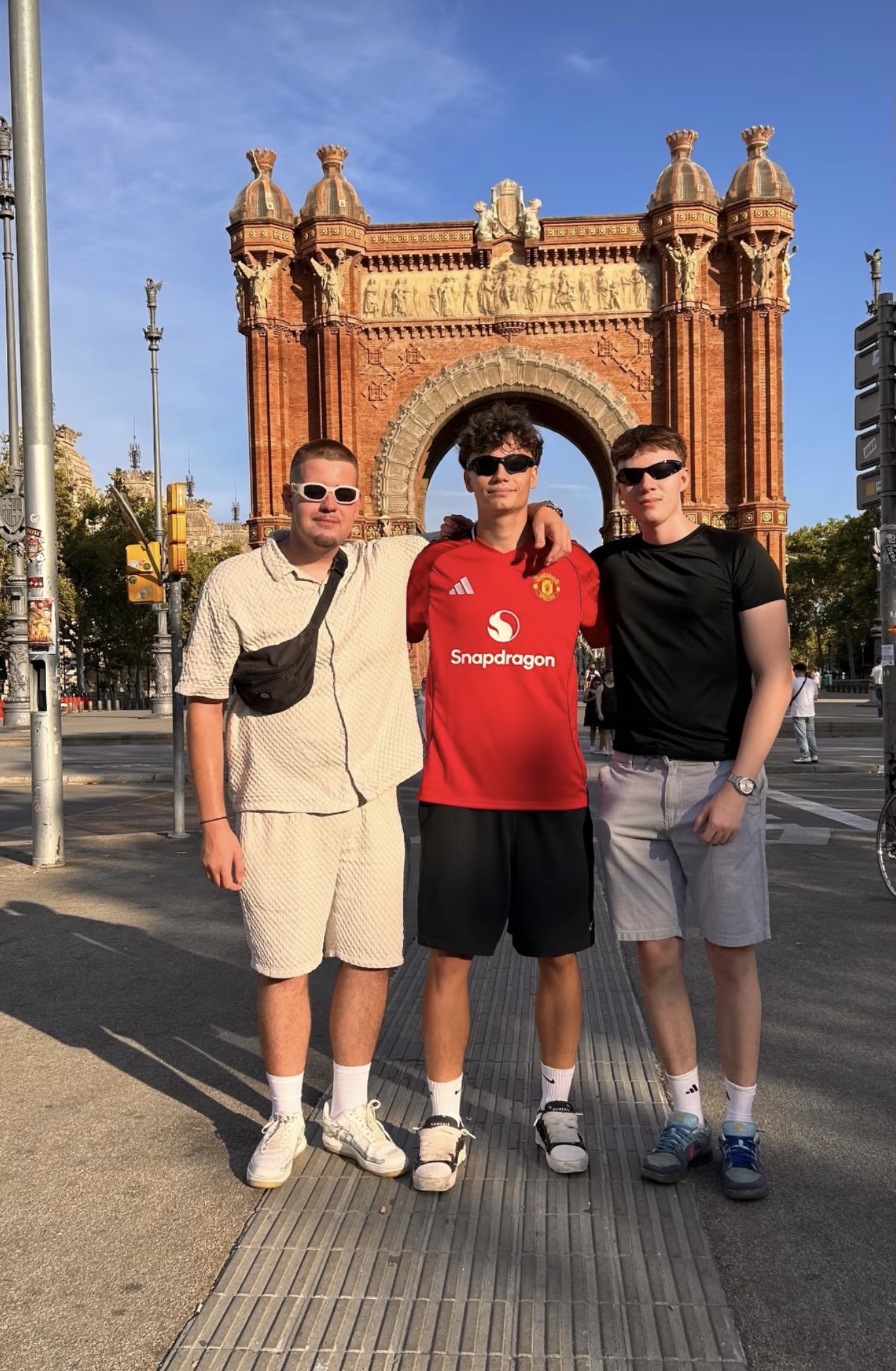 Group of travellers at the Arc de Triomf, Barcelona