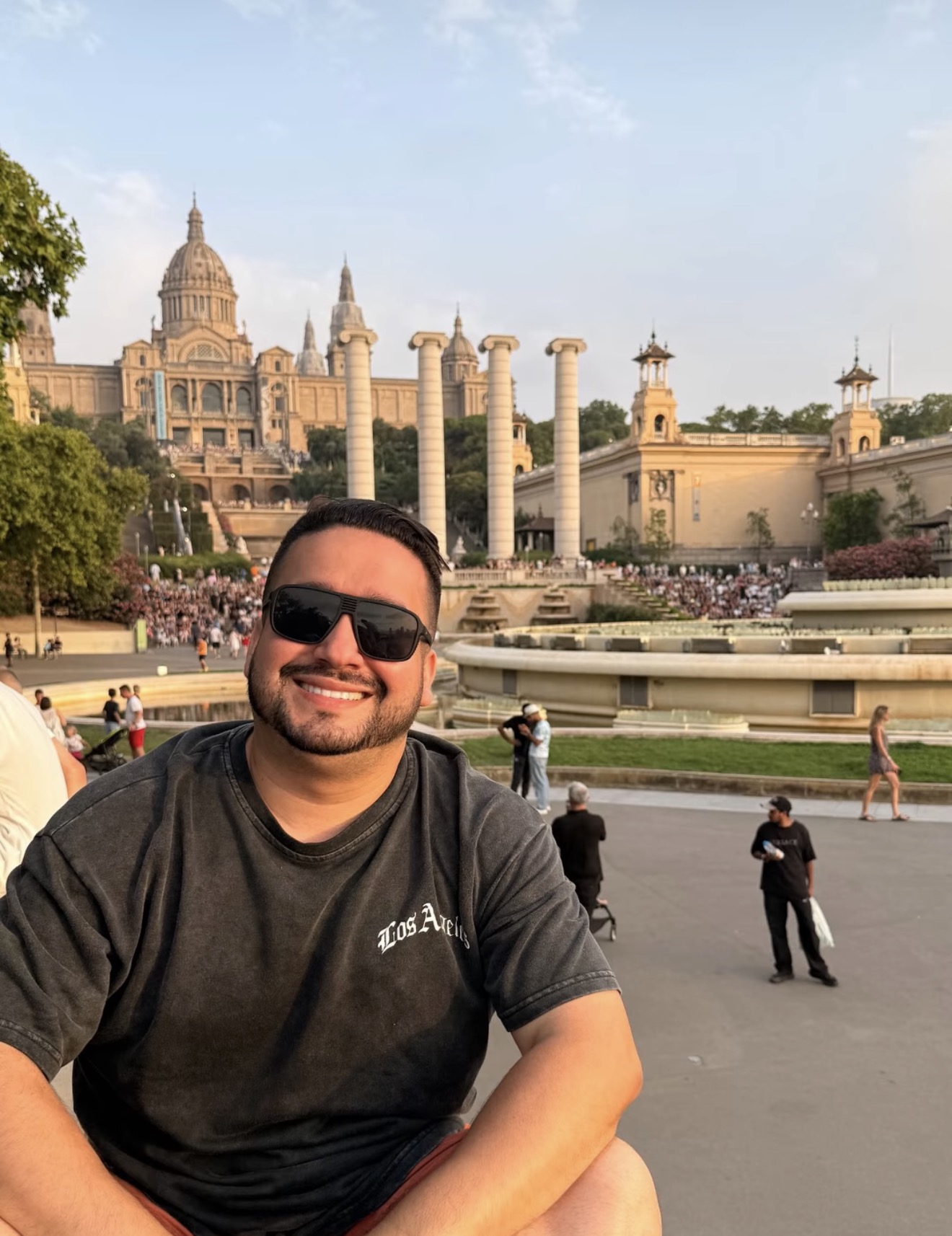 Traveller in front of the National Palace on Montjuïc, Barcelona