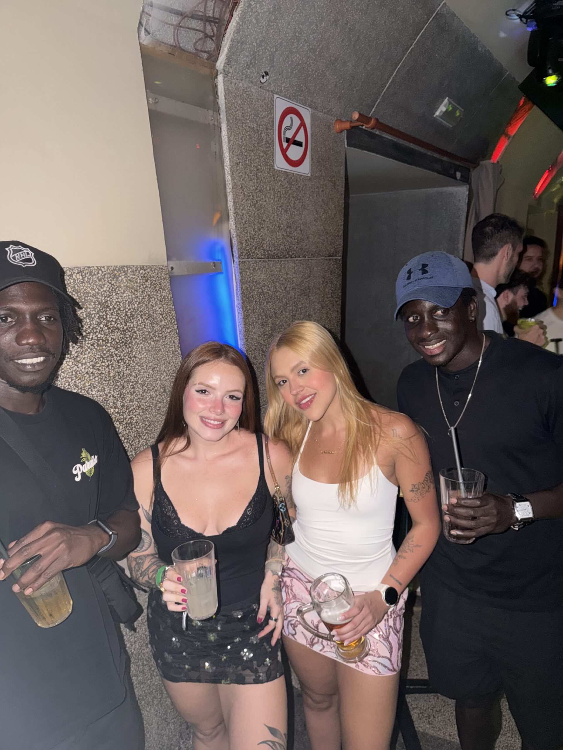 Group of travellers with drinks at a Barcelona bar