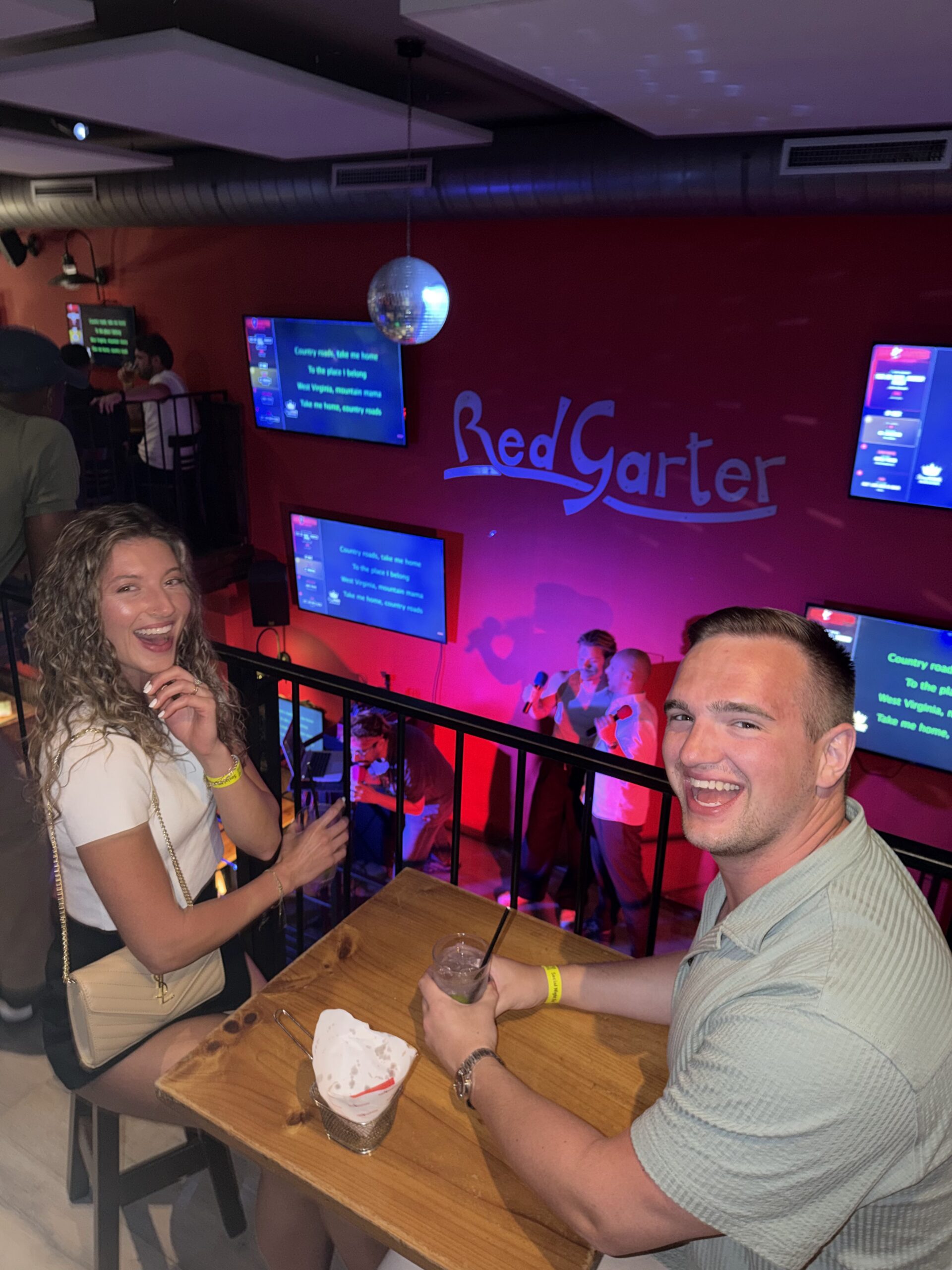 Travellers at the bar counter during an evening event