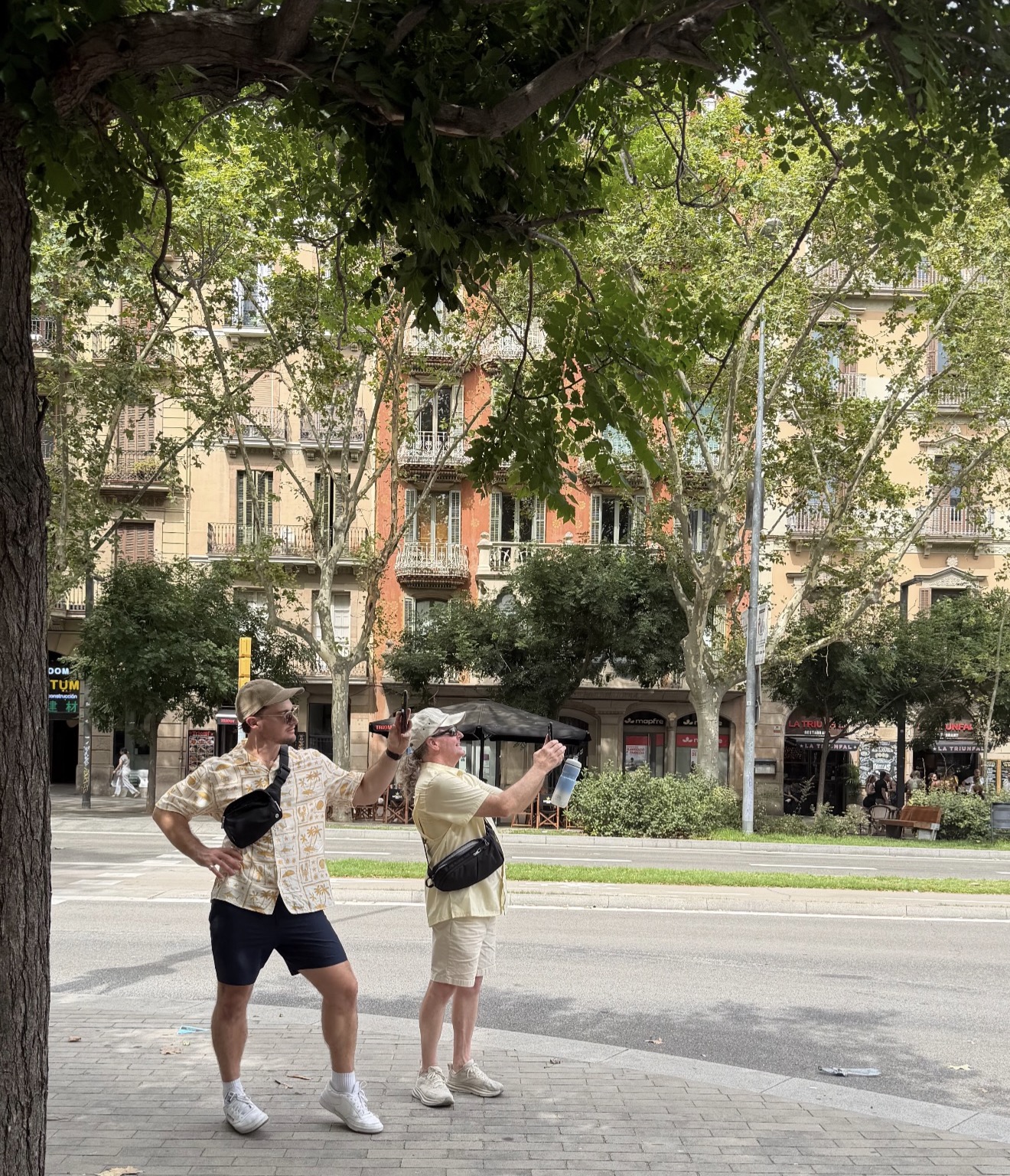 Travellers taking photos in a Barcelona park