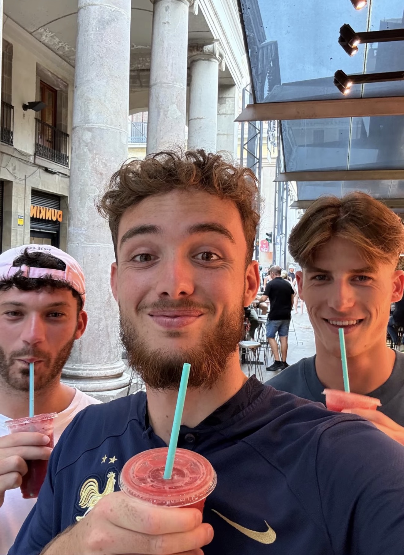 Travellers with drinks at an indoor spot in Barcelona