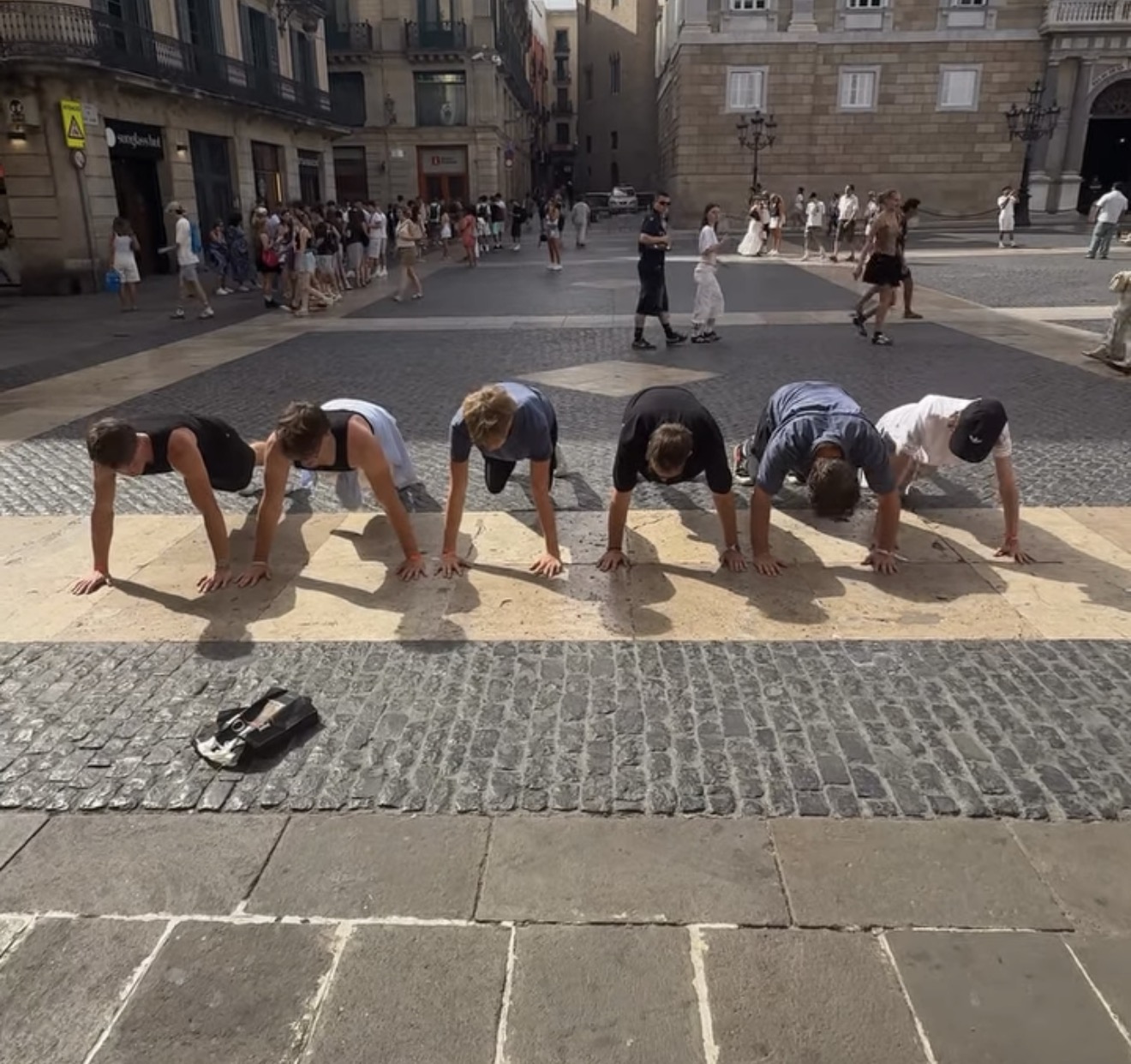 Group of travellers in a street in the old town of Barcelona