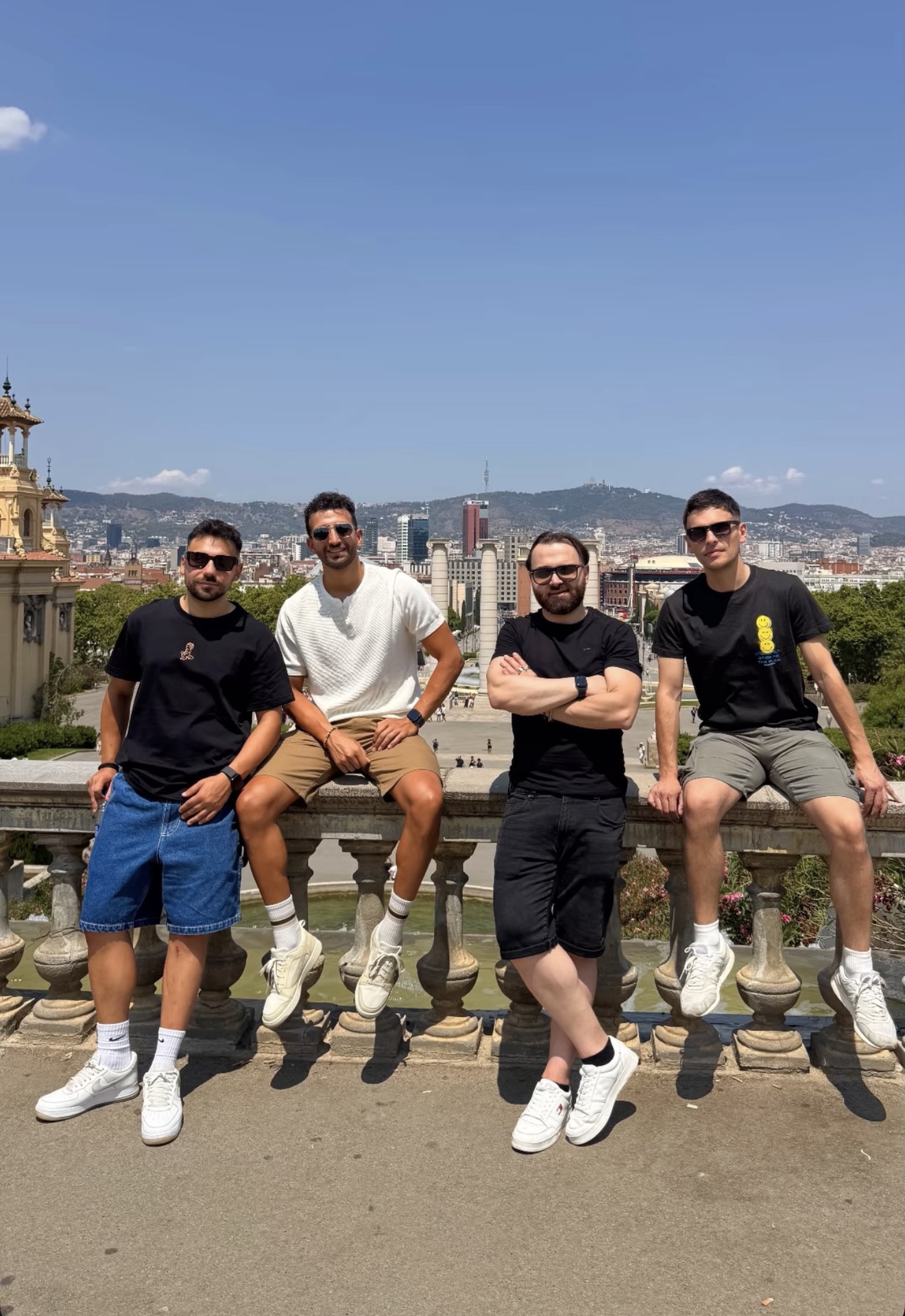 Group of travellers sitting outdoors in Barcelona