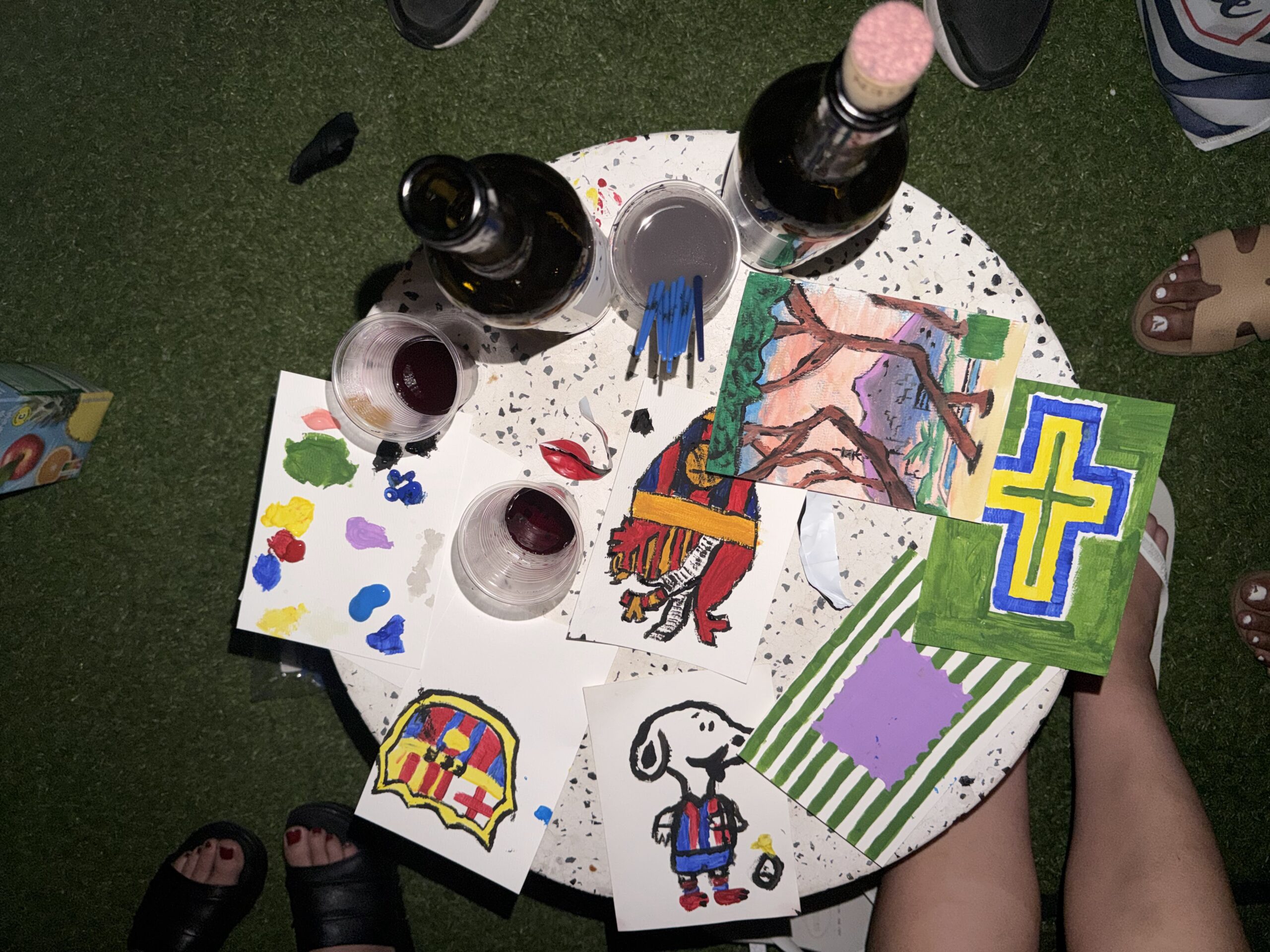 Finished canvas and paints on the table