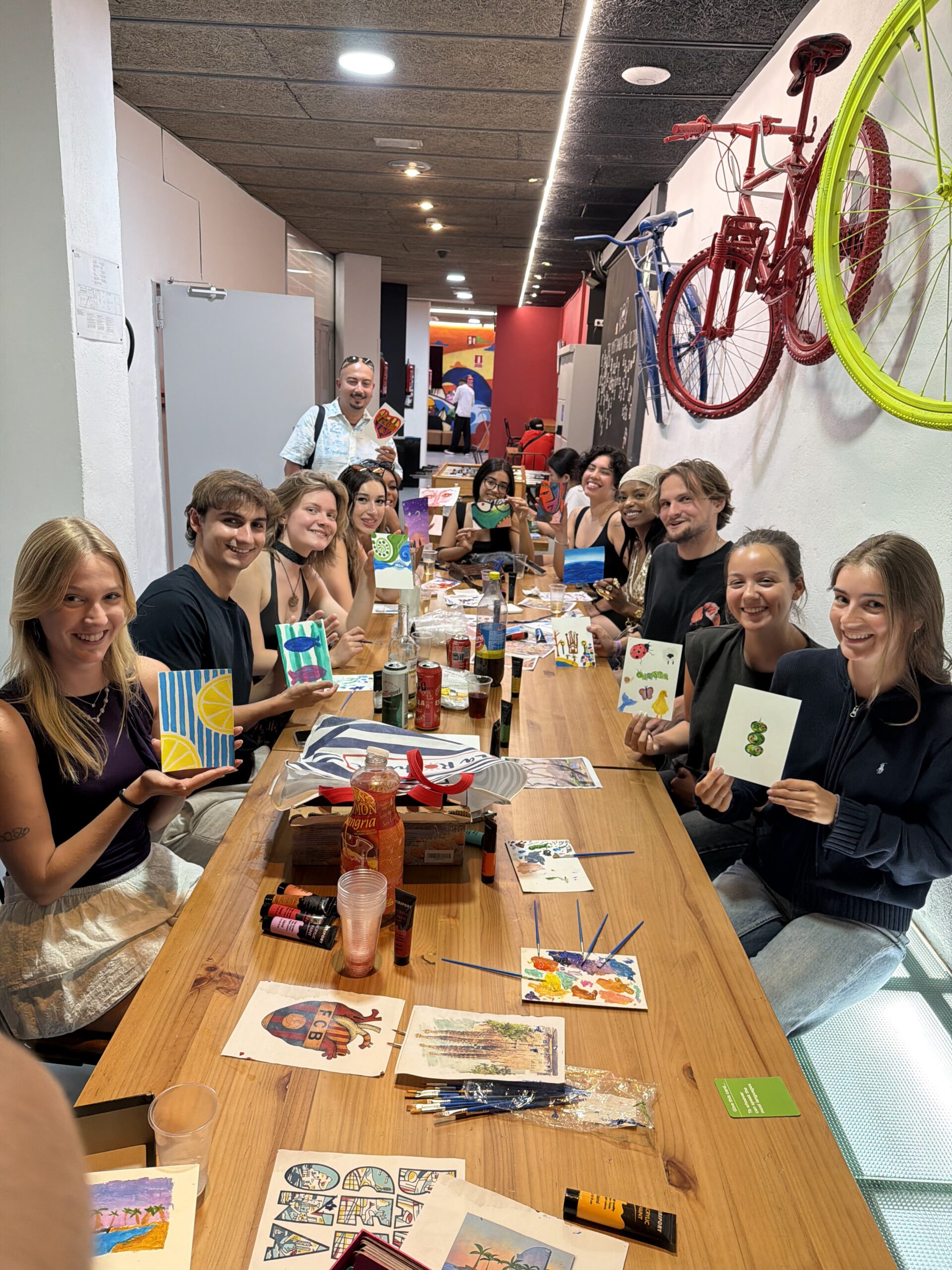 Travellers painting together at Sip and Paint in Barcelona
