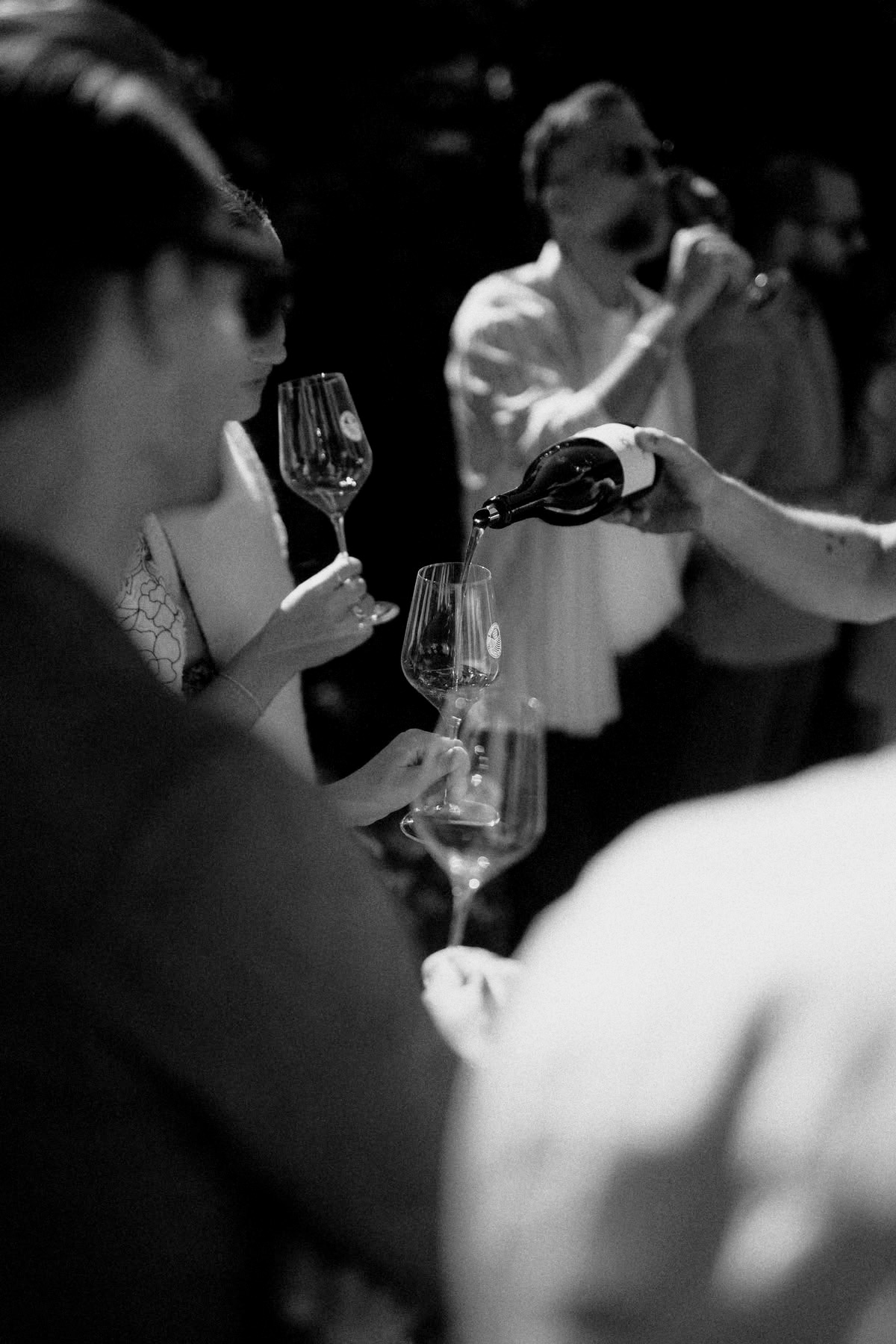 Wine being poured at a tasting evening