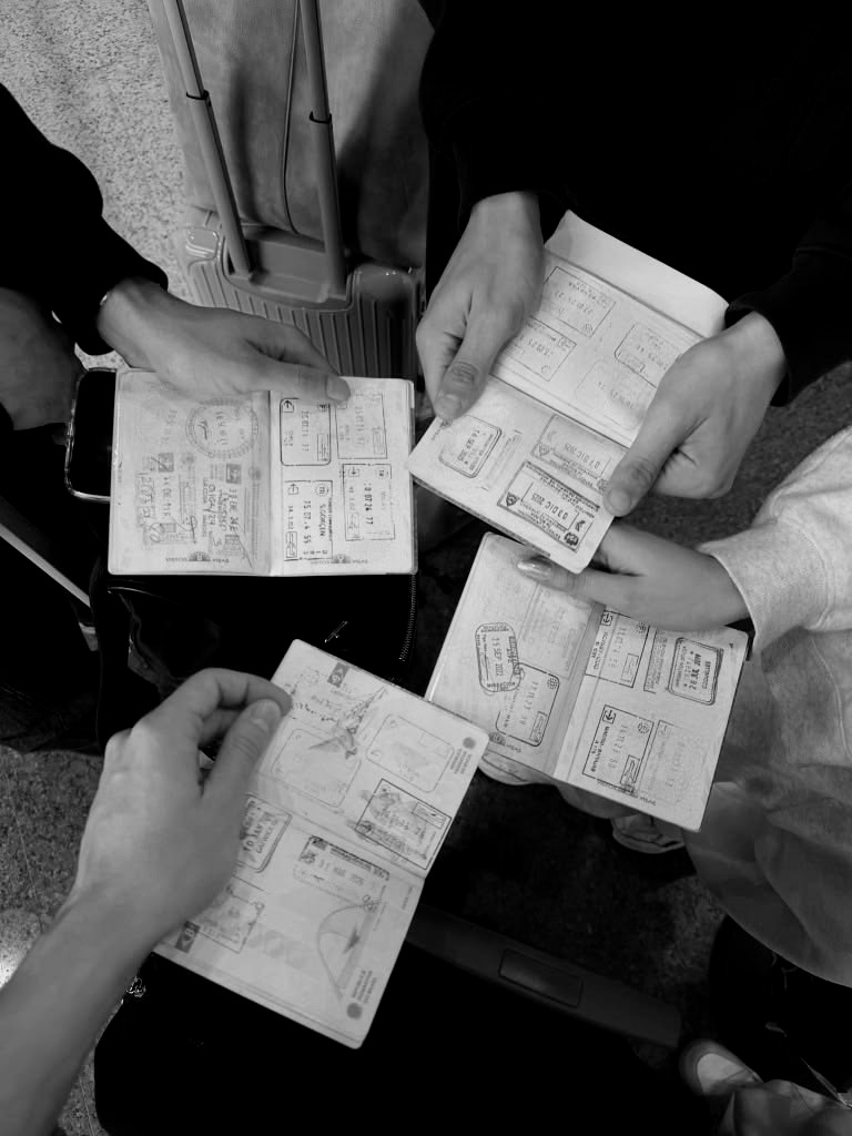 Travellers comparing passport stamps